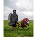 Lietus pončo 'Trekking', Origin Outdoors, R179420, melns, 210T poliesters, ūdensizturīgs, ar kapuci un integrētu somu